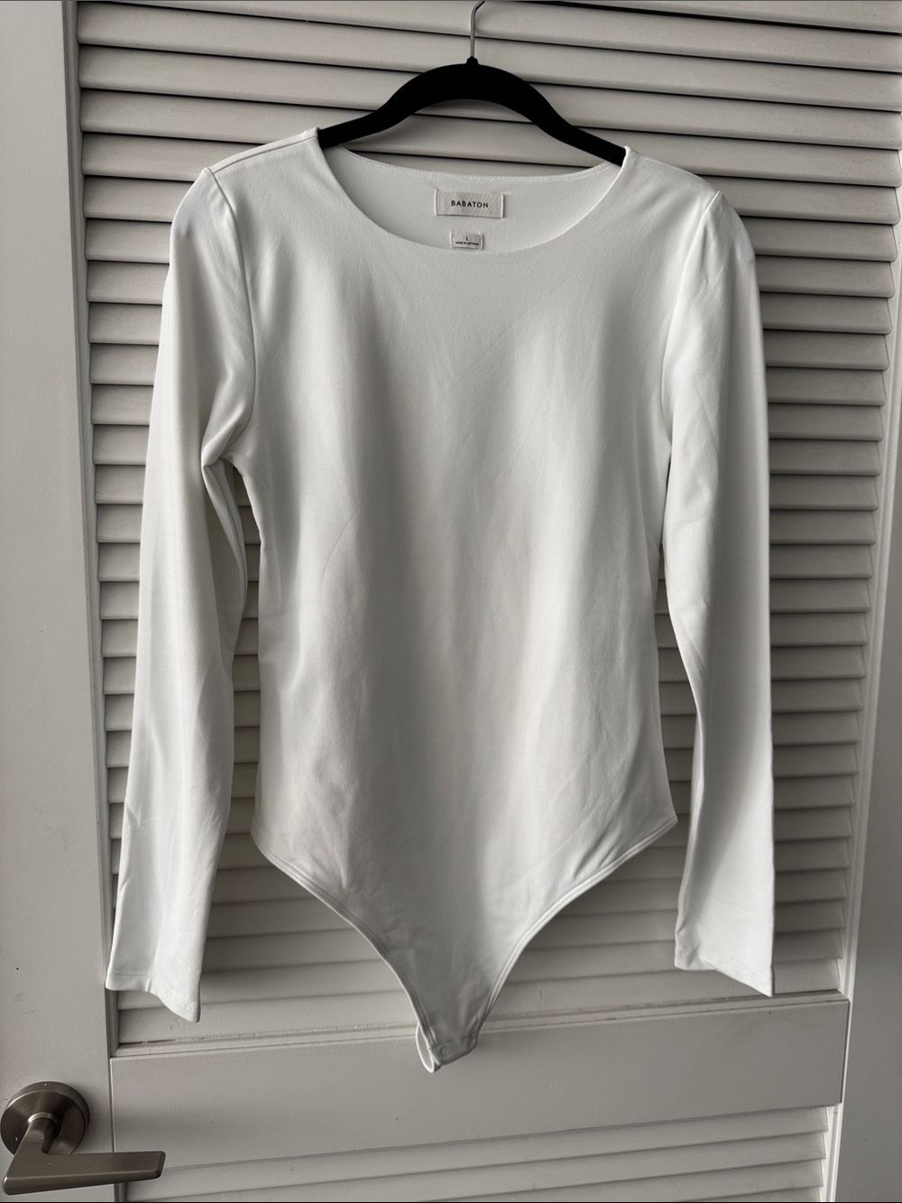 Babaton White Long-Sleeve One-Piece Bodysuit